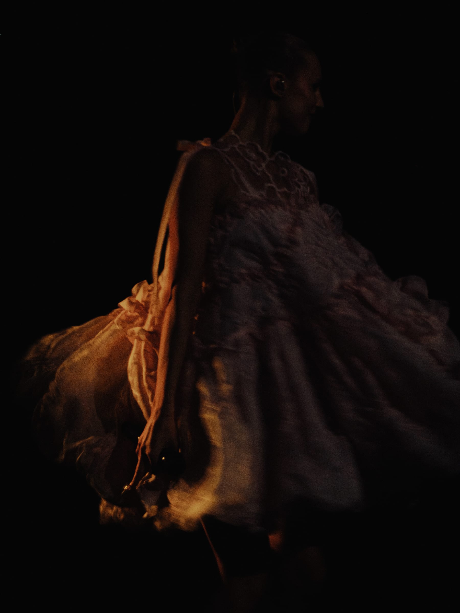 Rope and cloth close up, lit warm against the dark