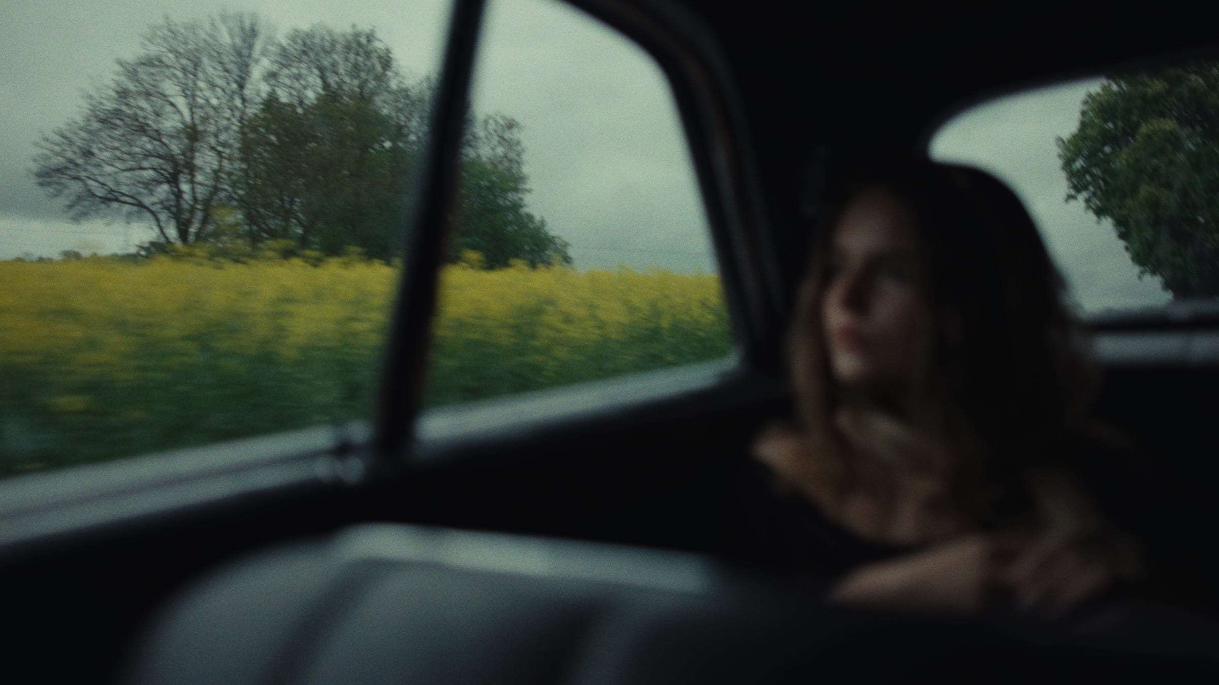 A vintage car on an overcast road
