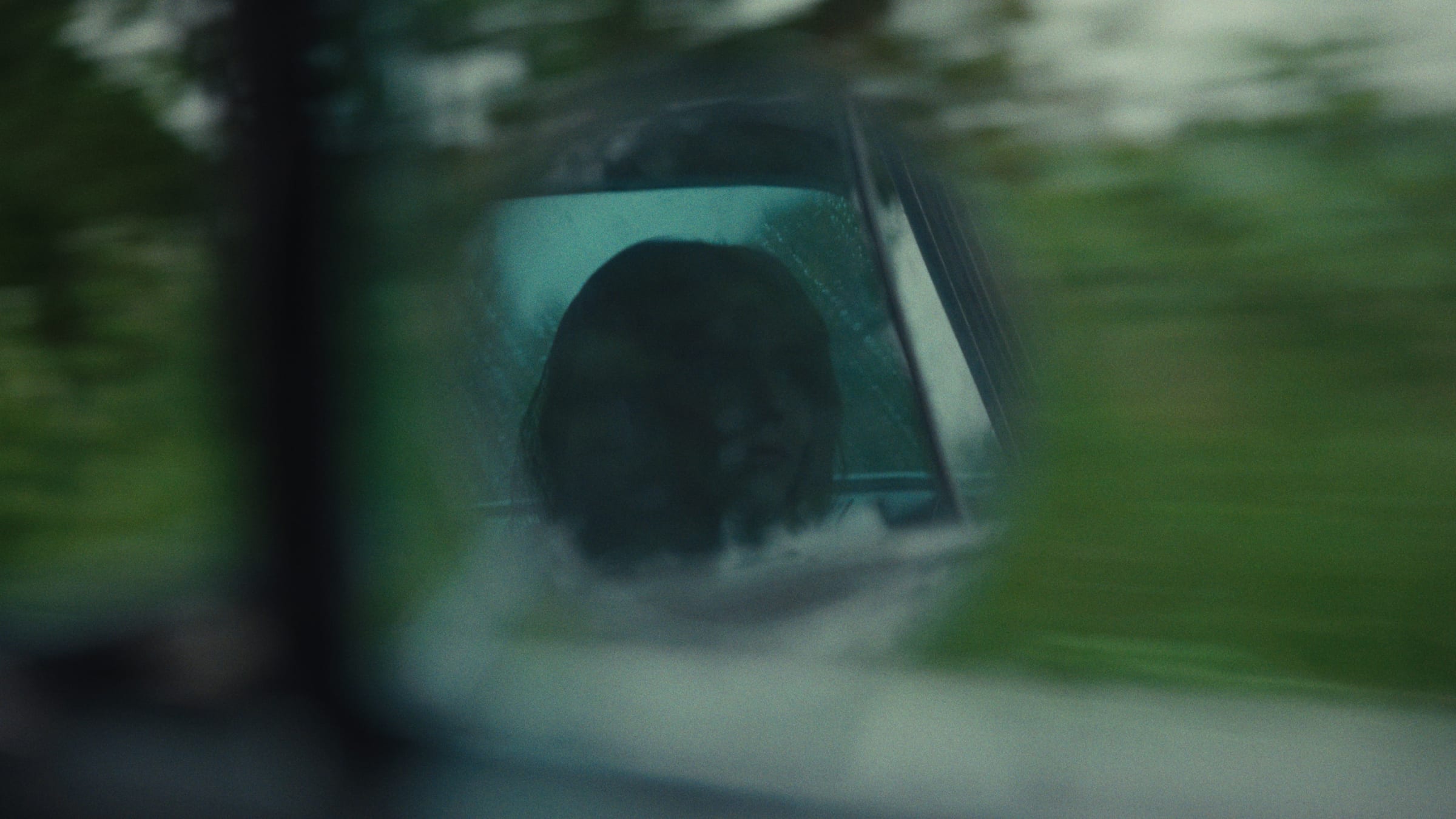 A film still in muted green